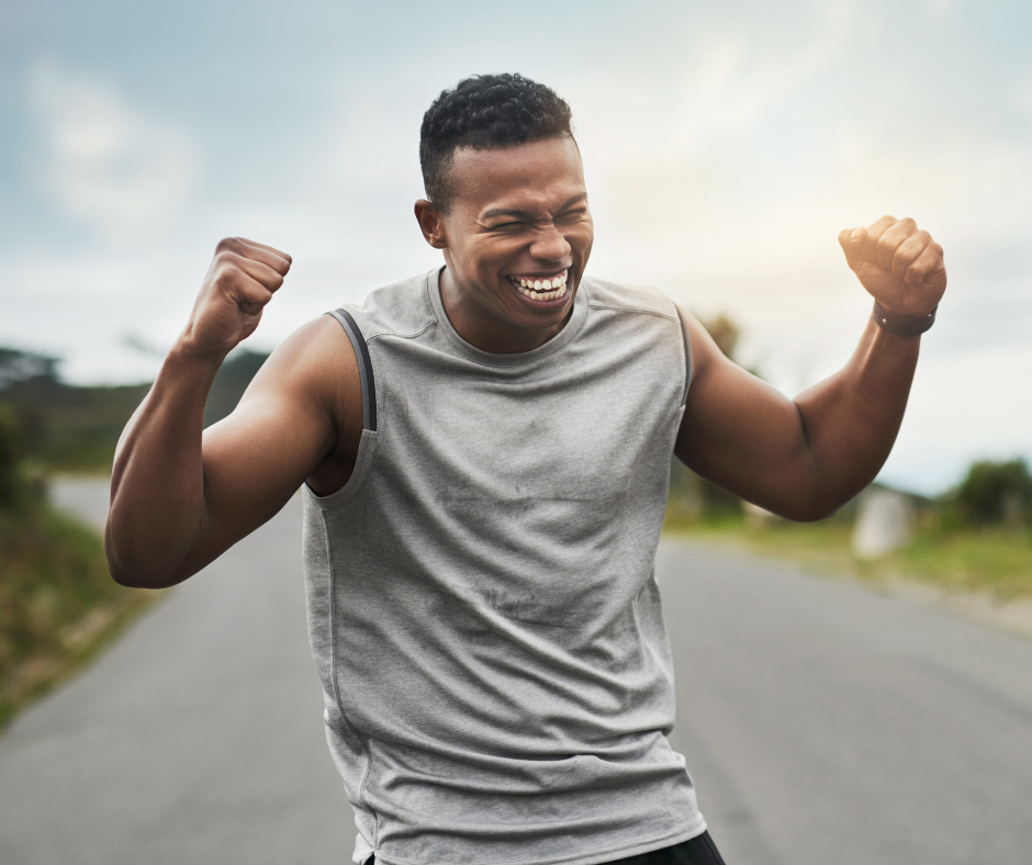 Man pumping his fists in victory