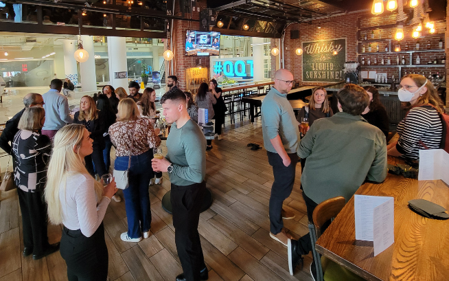 People in restobar standing and networking